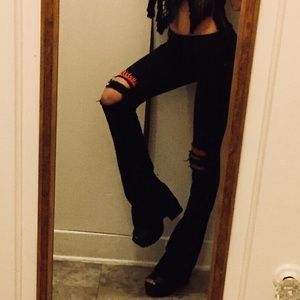 Black flare Carmar jeans with flame patches